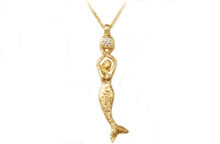 Hammered gold goddess pendant with a mermaid and a diamond
