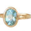 Oval teal sapphire organic gold ring in profile