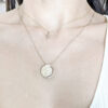Gold necklace crescent moon, shown on neck