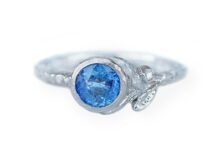 Blue sapphire ring with white gold leaves