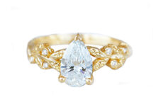 pear shape lab diamond ring with golden leaves and accent diamonds