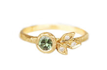 green sapphire, marquise diamonds ring with golden leaves