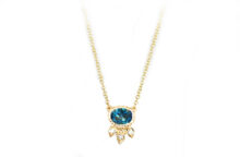 oval necklace with london blue topaz and diamonds, and golden leaves