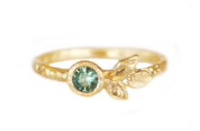Golden leaves ring with green sapphire