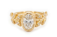 lab diamond on golden leaves ring with accent diamonds set in gold leaves