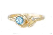 Golden leaves ring with blue sapphire and accent diamond