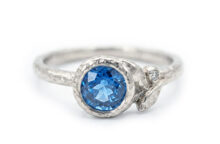 white gold ring with blue sapphire and small diamond