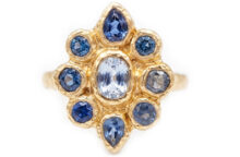 statement gold ring with nine blue sapphires
