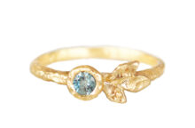 three leaves golden ring with teal sapphire