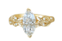 Custom marquise diamond gold ring with accent diamonds