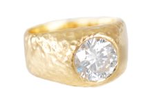 Textured gold chunky ring with a moissanite