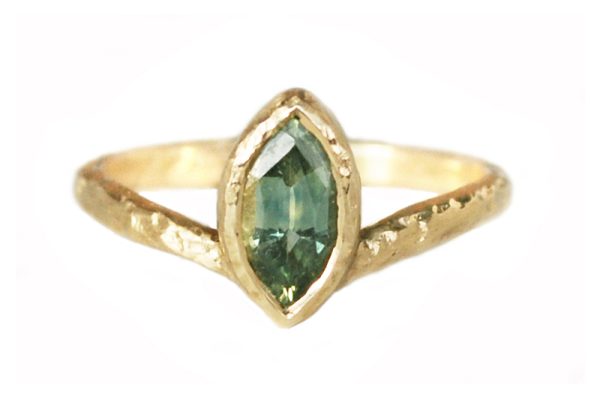 green marquise sapphire ring with textured gold