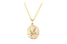 oval gold medallion with carved leaves and diamonds
