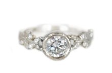 White gold engagement ring with lab grown diamonds and golden leaves